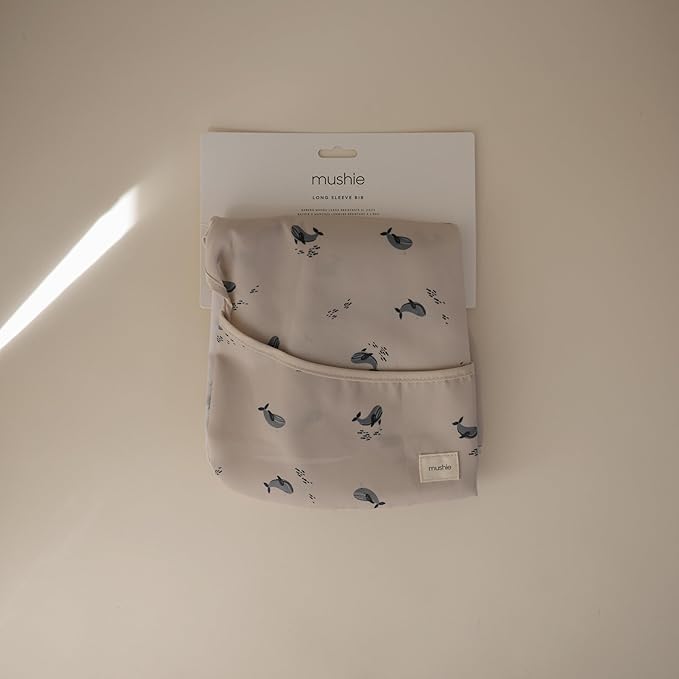 mushie Long Sleeve Baby Bib | Water Resistant Adjustable Fit for Ages 6-24 Months