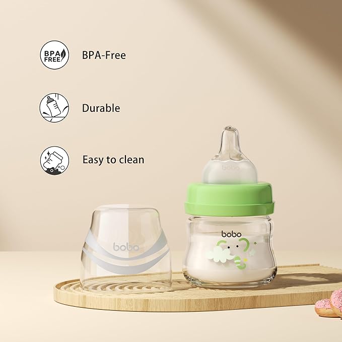 YOHKOH Glass Baby Bottles with Slow Flow Nipple, Newborn Anti-Colic Baby Bottles for 0+ Months, Wide Neck Feeding Bottle, Clear (Green, 2.7oz (Pack of 2))