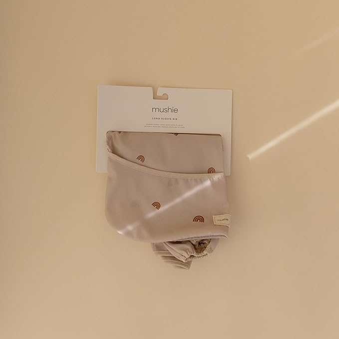 mushie Long Sleeve Baby Bib | Water Resistant Adjustable Fit for Ages 6-24 Months