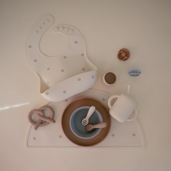 mushie Silicone Baby Bib | Adjustable Fit Waterproof Bibs (Pretzel)