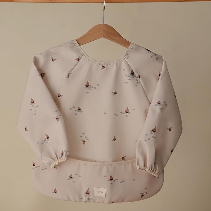 mushie Long Sleeve Baby Bib | Water Resistant Adjustable Fit for Ages 6-24 Months