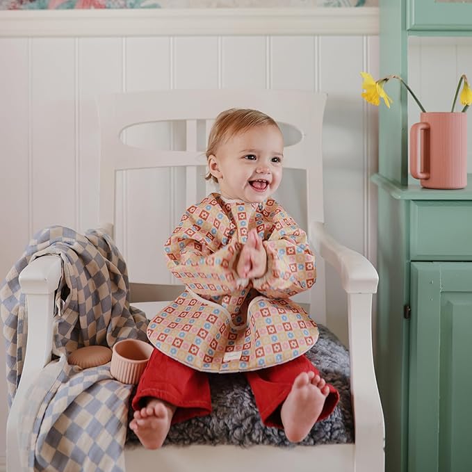 mushie Long Sleeve Baby Bib | Water Resistant Adjustable Fit for Ages 6-24 Months