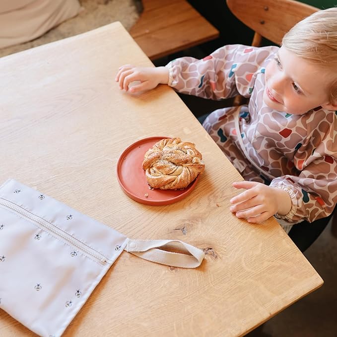 mushie Long Sleeve Baby Bib | Water Resistant Adjustable Fit for Ages 6-24 Months