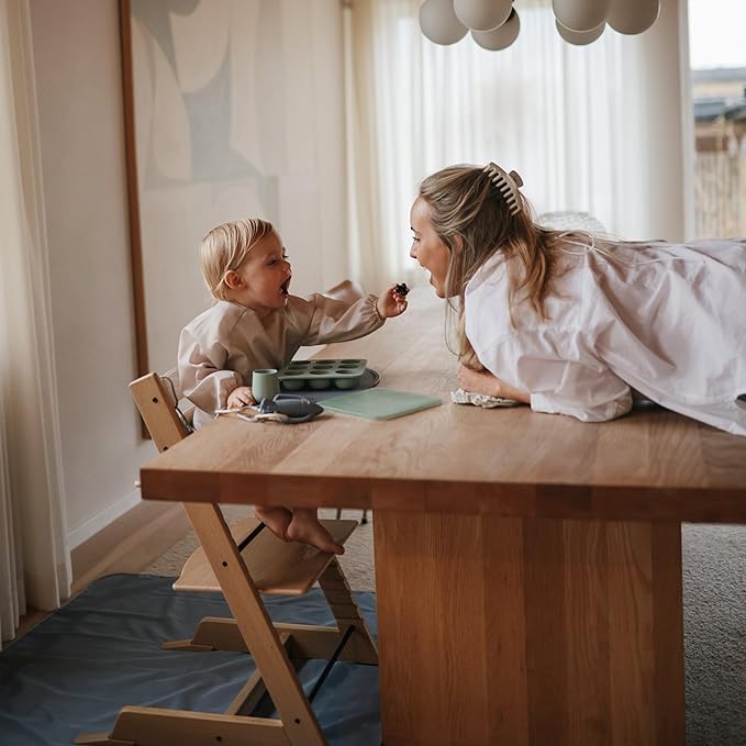 mushie Long Sleeve Baby Bib | Water Resistant Adjustable Fit for Ages 6-24 Months