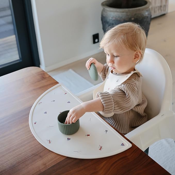 mushie Silicone Baby Bib | Adjustable Fit Waterproof Bibs (Circus)