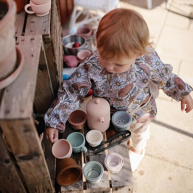 mushie Long Sleeve Baby Bib | Water Resistant Adjustable Fit for Ages 6-24 Months